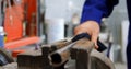 Mechanic cleaning bench vises in garage 4k