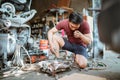 mechanic cleaning an engine cowling cylinder using a duster gun