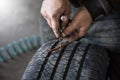 mechanic closes a hole in a tire in a workshop Royalty Free Stock Photo