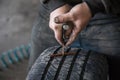 mechanic closes a hole in a tire in a workshop Royalty Free Stock Photo