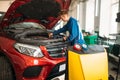 Mechanic connects air conditioning system Royalty Free Stock Photo