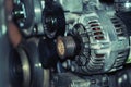 a mechanic disassembles an old dirty car engine on a red lift for repair and tuning turbo car Royalty Free Stock Photo