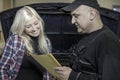 Mechanic explaining repair Royalty Free Stock Photo