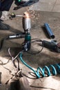 Mechanic fixes pipe on corrugation silencer