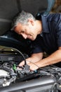 Mechanic fixing car