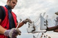 Mechanic fixing plow on the tractor Royalty Free Stock Photo