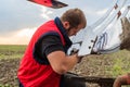 Mechanic fixing plow on the tractor Royalty Free Stock Photo