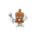 A mechanic gingerbread bell mascot character fix a broken machine