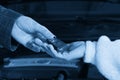 Mechanic giving car keys to customer after servicing Royalty Free Stock Photo