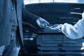 Mechanic giving car keys to customer after servicing Royalty Free Stock Photo