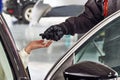 Mechanic giving car keys to female customer after servicing Royalty Free Stock Photo