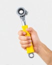 Mechanic demonstrating use of ratchet tool in a workshop during day time for automotive repairs and maintenance tasks Royalty Free Stock Photo