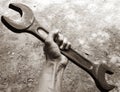 Mechanic hand hold spanner tool in hand Royalty Free Stock Photo