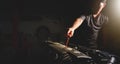 Mechanic hand is pulling dipstick of the car engine for checking motor oil level and auto repair shop double exposure blur on Royalty Free Stock Photo