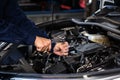 Mechanic hand using wrench to repair engine, car service Royalty Free Stock Photo