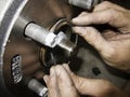 Mechanic hands fixing car