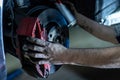 Mechanic hands maintenance brakes Royalty Free Stock Photo