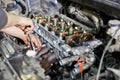 Mechanic hands tighten nut with wrench Royalty Free Stock Photo