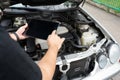 Mechanic hold tablet in hand for diagnostic or tune engine with smart technology of wireless communication