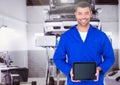 Mechanic holding digital tablet in garage Royalty Free Stock Photo