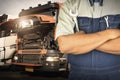 Mechanic Holding A Wrench for Semi Truck Maintenance. Checking the Truck`s Safety. Repairman Service Shop. Inspection Safety. Royalty Free Stock Photo