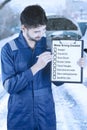 Mechanic holds winter driving tips Royalty Free Stock Photo