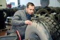 mechanic inspecting hgv tyre