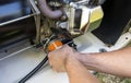 Mechanic Inspecting and replacing engine oil filter in stand up generator. Royalty Free Stock Photo