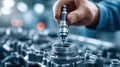 Mechanic installing a spark plug in an engine Royalty Free Stock Photo