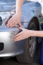 Mechanic looking at car crack Royalty Free Stock Photo