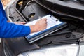 Mechanic maintaining car records