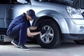Mechanic engineer repair car at car service station