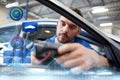 Mechanic man with diagnostic scanner at car shop Royalty Free Stock Photo