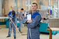 Mechanic man holding pen and folder Royalty Free Stock Photo