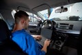 Mechanic man with laptop making car diagnostic Royalty Free Stock Photo