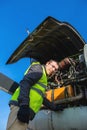 Mechanic near airplanes engine
