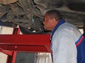 Mechanic Performing a Routine Service Inspection