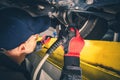 Mechanic Performing Scheduled Vehicle Inspection Royalty Free Stock Photo