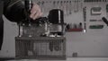 The mechanic performs the assembly of a modern automatic transmission DSG, close-up, robotic