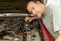 Mechanic Pouring Brake Fluis In A Master Cylinder