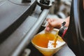 mechanic pouring oil to vehicle engine. serviceman changing motor oil in automobile repair service. maintenance & checkup in car Royalty Free Stock Photo