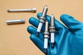 Mechanic holding three spark plugs in hand Royalty Free Stock Photo