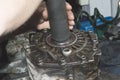 The mechanic presses the oil seal into the case of the transfer case