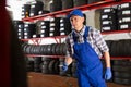 Mechanic ready to changing car tire using pneumatic wrench tool