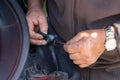 Mechanic repairing a car backlight Royalty Free Stock Photo