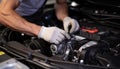 Mechanic repairing car engine, working in auto repair shop generated by AI Royalty Free Stock Photo