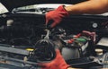 Mechanic is repairing the car and maintaining the integrity of the engine Royalty Free Stock Photo