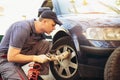 Mechanic repairman at car tyre