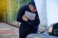 Mechanic repairman inspecting car, Maintaining car records.