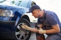 Mechanic repairman making tyre in workshop